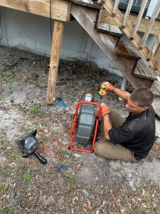 Brock with I Find Leaks using a Ridgid Sewer Inspection Camera in a cleanout.