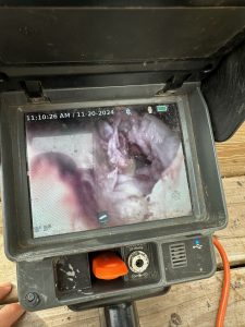 Clog or backup inside a sewer line on a Ridgid battery operated sewer camera.